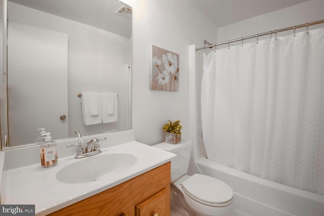 bathroom with vanity, shower / bath combination with curtain, toilet, and visible vents