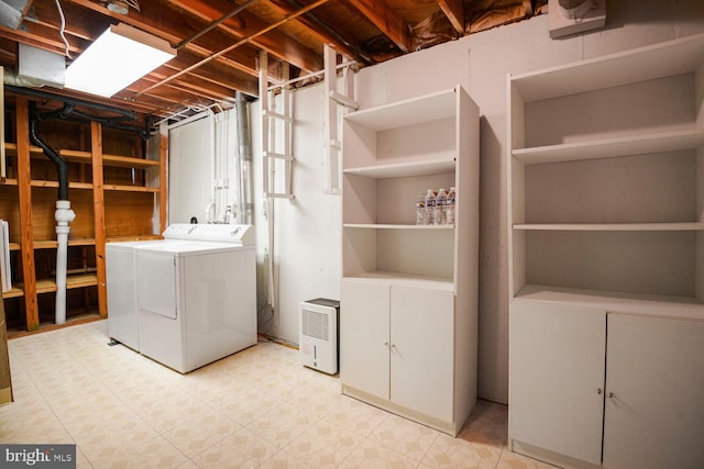 laundry area featuring washing machine and clothes dryer and laundry area