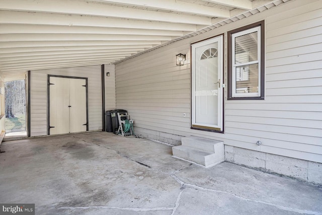 view of patio / terrace featuring a carport and entry steps