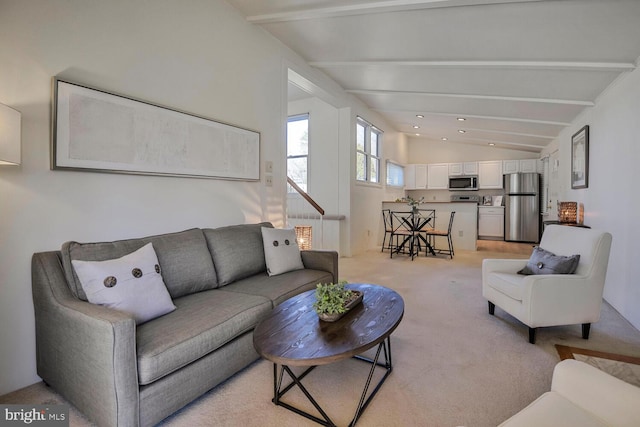 living room featuring lofted ceiling with beams, light carpet, and recessed lighting