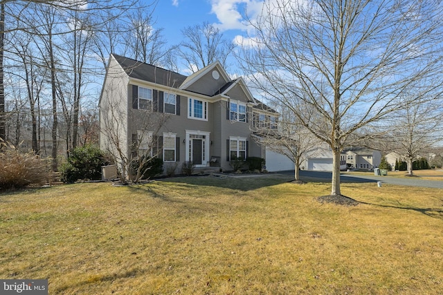 view of front of house with driveway and a front yard