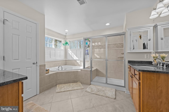 bathroom featuring a garden tub, visible vents, vanity, a shower stall, and tile patterned flooring