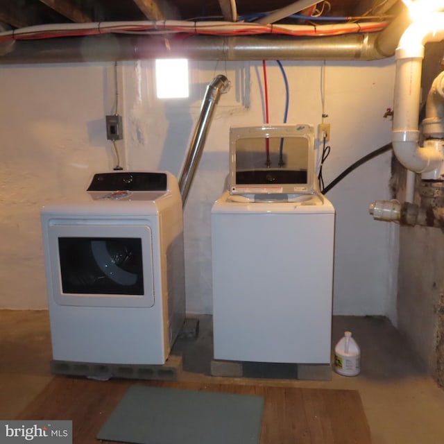 laundry room with washer and dryer and laundry area