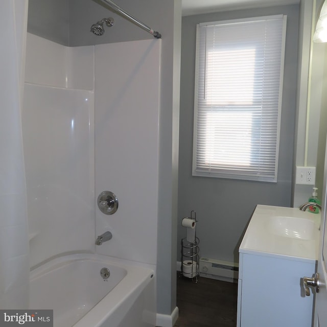 bathroom with a baseboard radiator, shower / bath combination, vanity, and wood finished floors