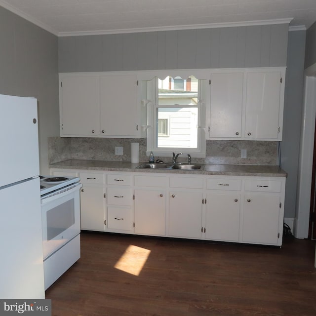 kitchen featuring white appliances, a sink, white cabinetry, and crown molding