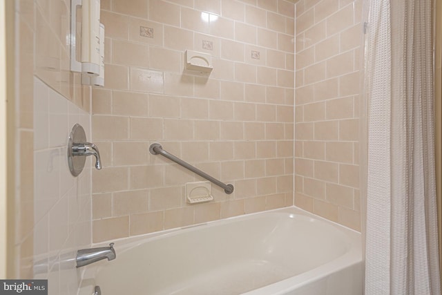 bathroom featuring shower / bath combo with shower curtain