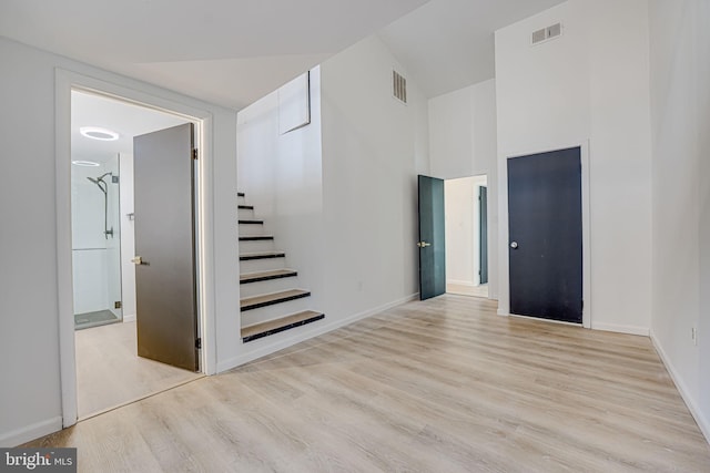 interior space featuring visible vents, baseboards, and wood finished floors