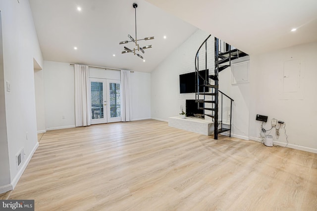 unfurnished living room with french doors, visible vents, stairway, light wood-type flooring, and baseboards