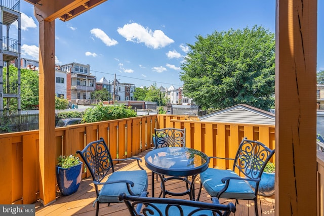 wooden terrace featuring a residential view