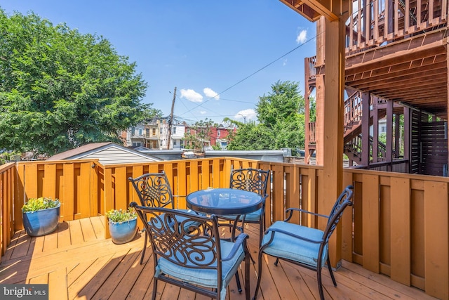 wooden deck featuring stairway