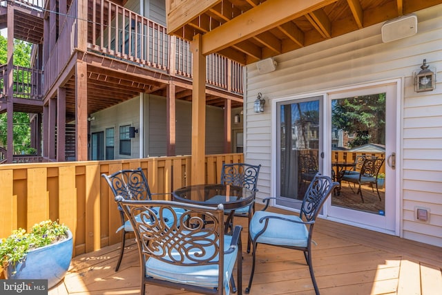 wooden deck with outdoor dining space