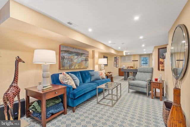 living room with recessed lighting, carpet, and visible vents