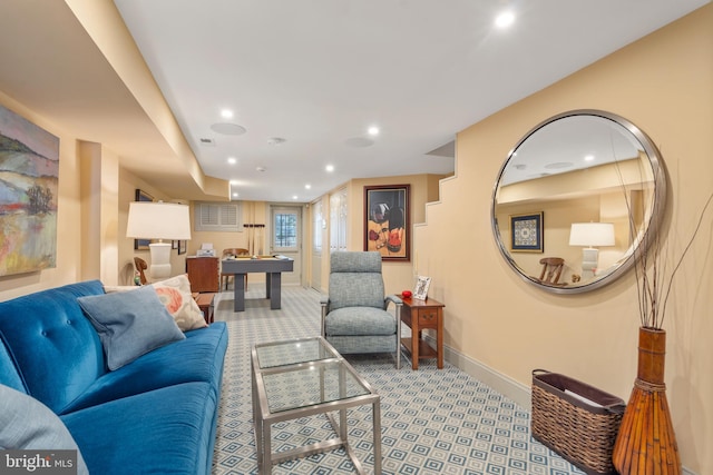 living room featuring recessed lighting, light colored carpet, and baseboards