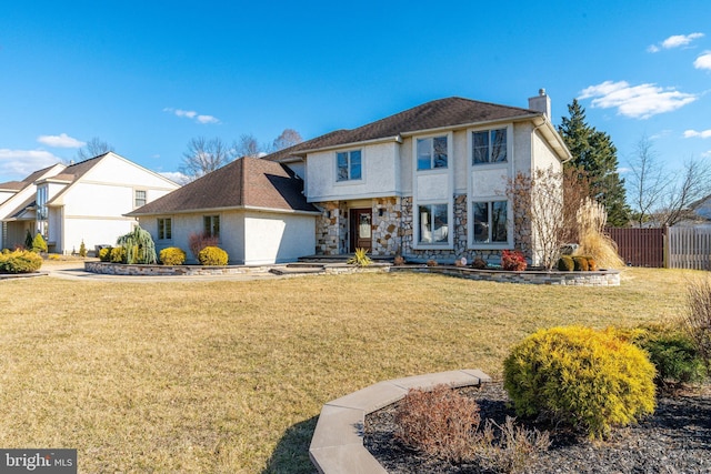 traditional home featuring a front yard, stone siding, fence, and a chimney