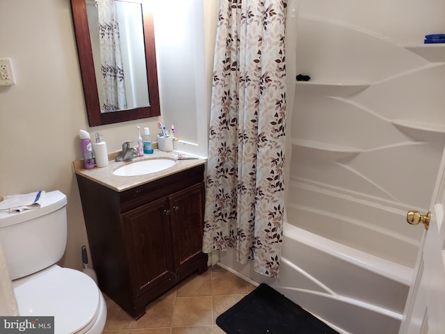 bathroom with shower / bath combo, vanity, toilet, and tile patterned floors