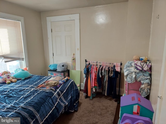 bedroom featuring dark colored carpet