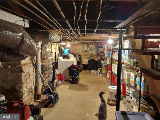 unfinished basement featuring washer / dryer