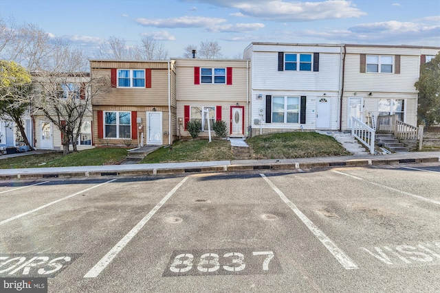 view of property featuring uncovered parking