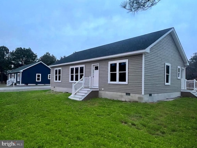 view of front of house featuring a front lawn and crawl space