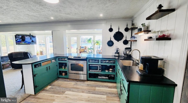 kitchen with open shelves, stainless steel electric stove, dark countertops, a sink, and a peninsula