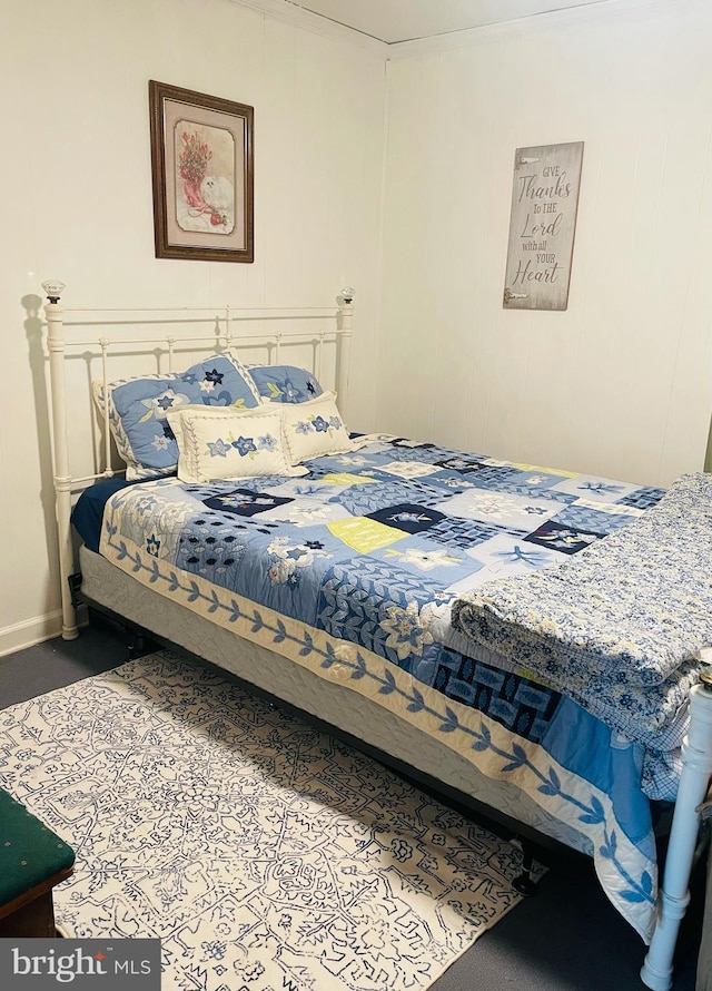 carpeted bedroom featuring baseboards