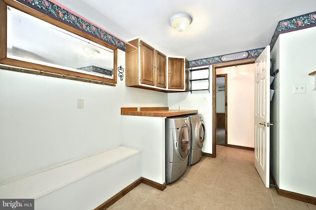60 Fernwood Ln, Fairfield, PA 17320 - washroom with washing machine and dryer, cabinet space, baseboards, and light tile patterned floors