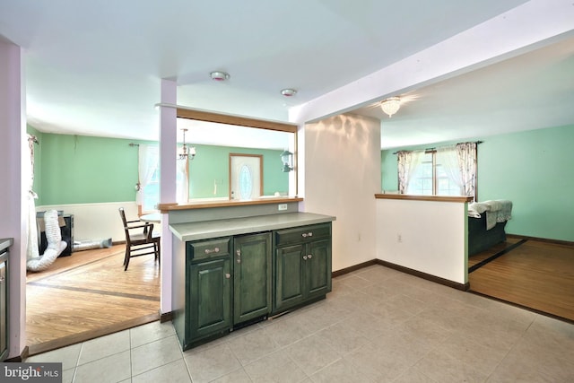 60 Fernwood Ln, Fairfield, PA 17320 - kitchen with light tile patterned floors, green cabinetry, a chandelier, and baseboards