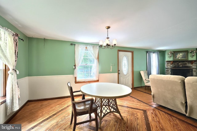 60 Fernwood Ln, Fairfield, PA 17320 - dining area with a chandelier, baseboards, and a stone fireplace