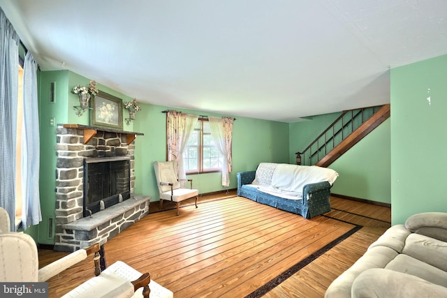 60 Fernwood Ln, Fairfield, PA 17320 - living area with wood finished floors, a stone fireplace, stairs, and baseboards