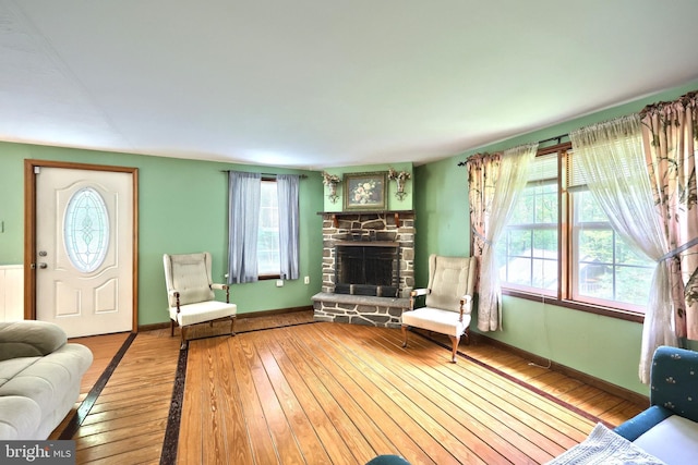 60 Fernwood Ln, Fairfield, PA 17320 - living area with wood-type flooring, a stone fireplace, and baseboards