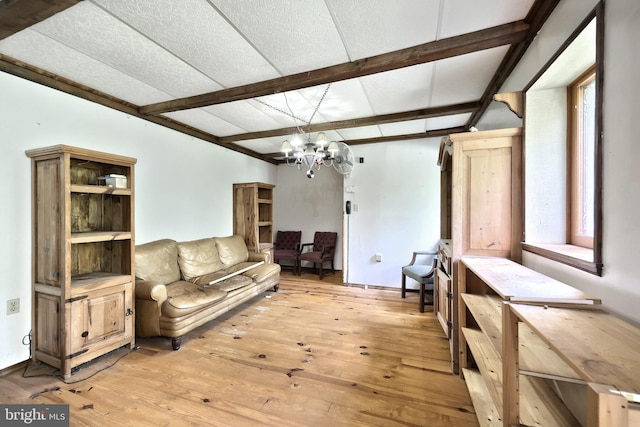 60 Fernwood Ln, Fairfield, PA 17320 - living room with light wood-style floors, a chandelier, beamed ceiling, and baseboards
