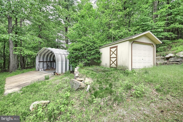 60 Fernwood Ln, Fairfield, PA 17320 - view of yard featuring a carport, an outdoor structure, and a wooded view