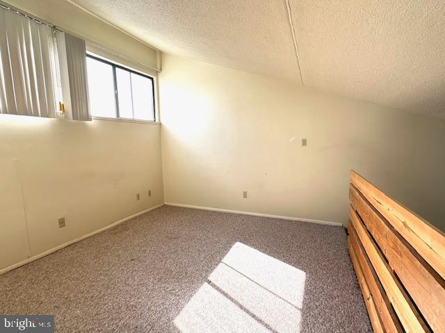 808 Stratford Dr Unit 32, State College, PA 16801 - carpeted spare room featuring a textured ceiling and baseboards
