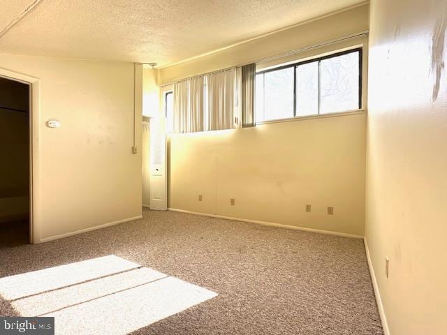 808 Stratford Dr Unit 32, State College, PA 16801 - carpeted spare room with a textured ceiling and baseboards