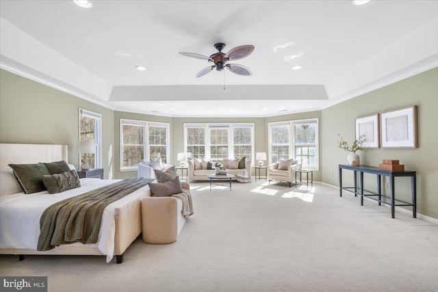 carpeted bedroom featuring ornamental molding, recessed lighting, a raised ceiling, and baseboards