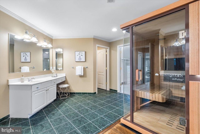 bathroom with vanity, baseboards, crown molding, and tile patterned floors