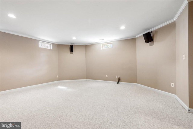 basement featuring baseboards, recessed lighting, and crown molding