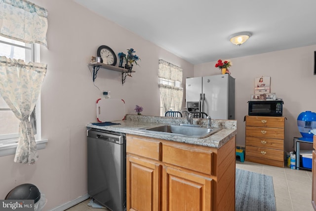 kitchen with light tile patterned flooring, a sink, refrigerator with ice dispenser, black microwave, and dishwasher