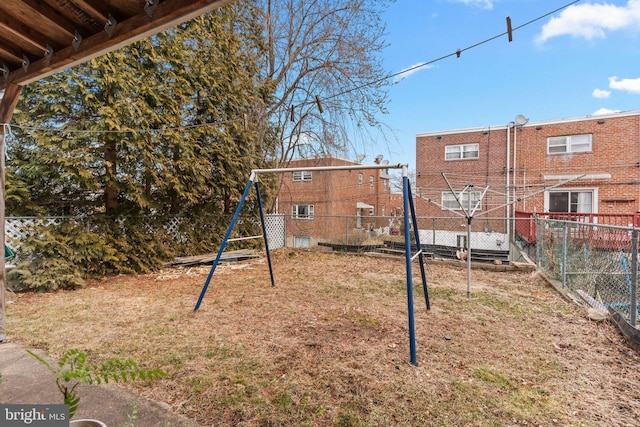 view of playground featuring fence