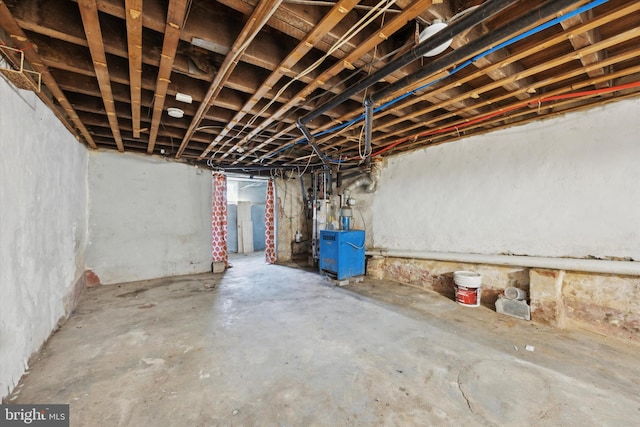 unfinished basement with a heating unit