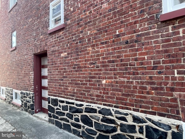 exterior space with brick siding