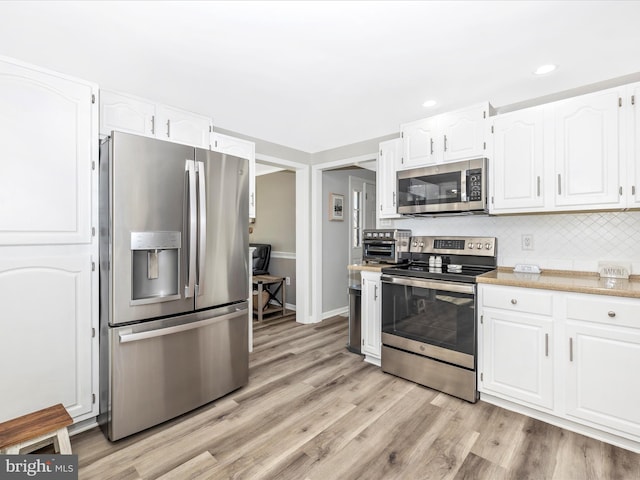 kitchen with stainless steel appliances, recessed lighting, light wood-style flooring, backsplash, and white cabinets