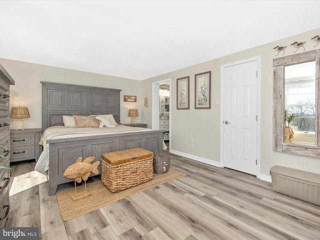 bedroom featuring light wood-style flooring and baseboards