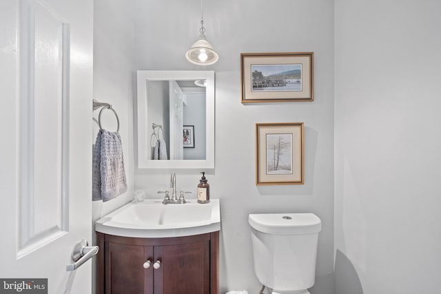 bathroom featuring toilet and vanity