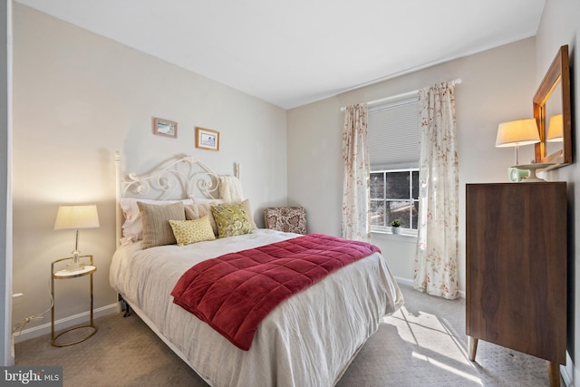 bedroom with carpet floors and baseboards