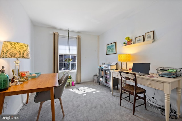 carpeted office space with baseboards