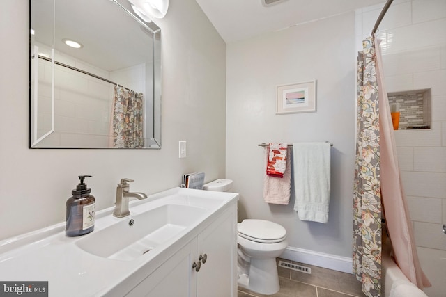 full bathroom with visible vents, baseboards, toilet, tile patterned flooring, and vanity