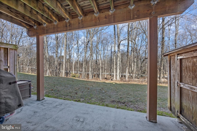 view of patio featuring a view of trees