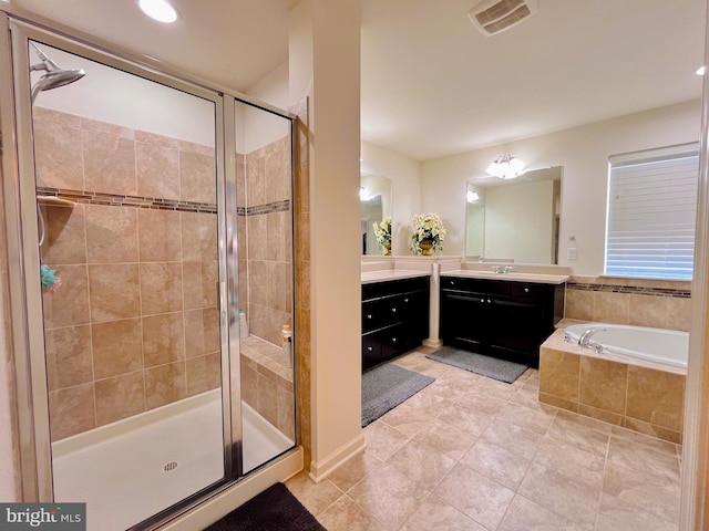 bathroom with visible vents, a shower stall, vanity, tile patterned flooring, and a bath