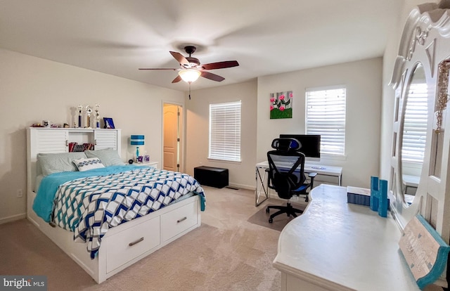 bedroom with light carpet, a ceiling fan, and baseboards